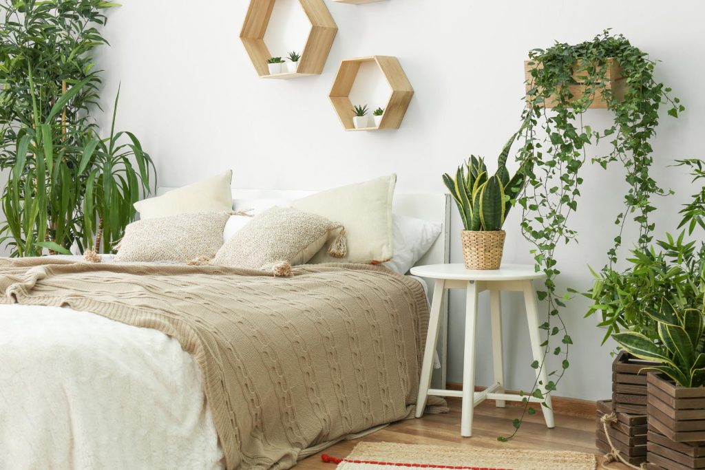 A tranquil bedroom full of live houseplants