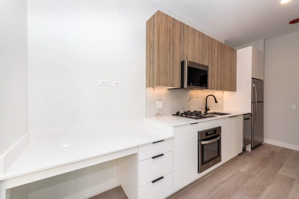 A look at a great solution fro work from home renters. A built in desk near the kitchen.