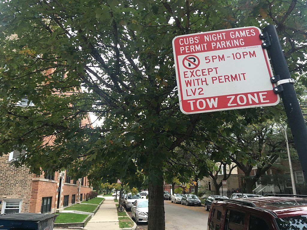 A street parking sign for Cubs game nights in Chicago