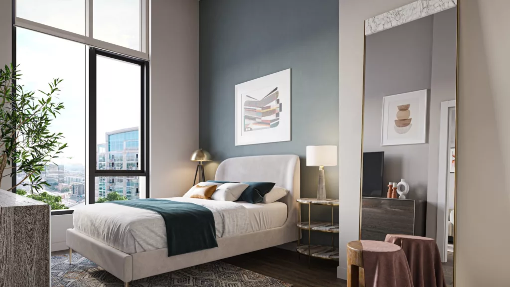An image of a beautiful bedroom, complete with floor to ceiling windows, at One Six Six luxury apartments in downtown Chicago.