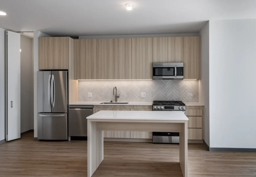 A modern kitchen inside an apartment at The Lydian luxury apartments