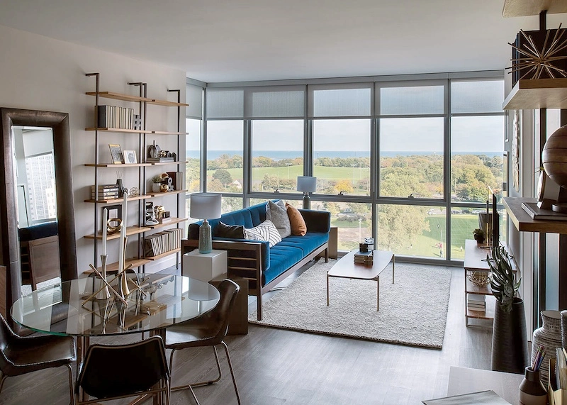 A bright, sun-lit unit in Eight Eleven Uptown, a luxury apartment building in Chicago's Uptown neighborhood.