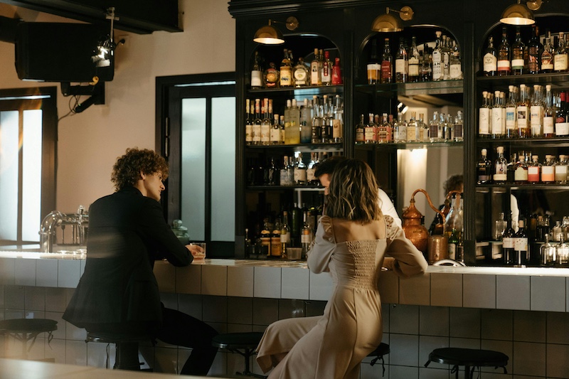 Two strangers flirting in a Chicago West Loop bar